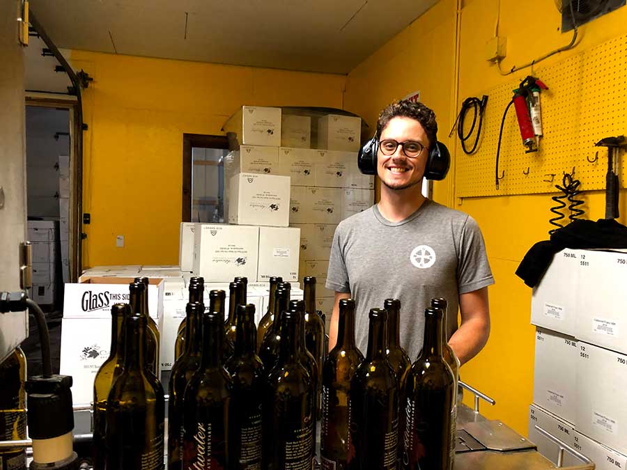 Wes Andrew, harvest intern, bottling wine