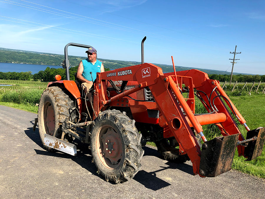 Vineyard worker Mike Betts on a tractor.