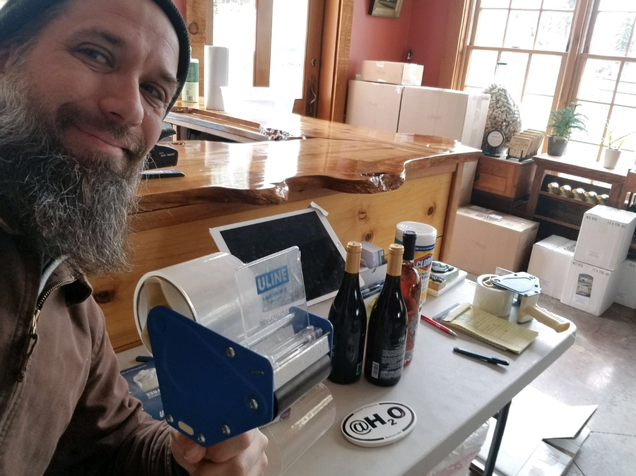 Winemaker, George Nosis, packing wine.